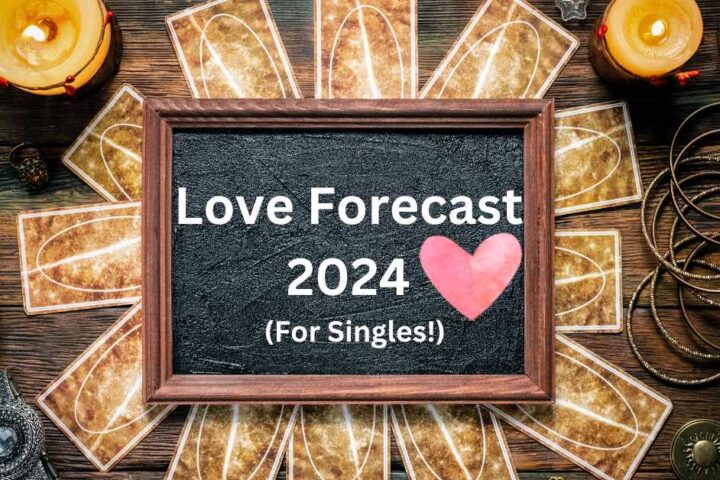 A circle of face-down tarot cards surrounds a chalkboard that reads 'Love Forecast 2024 (For Singles!)' with a pink heart. The image represents the mystique and cosmic guidance awaiting singles in the coming year.